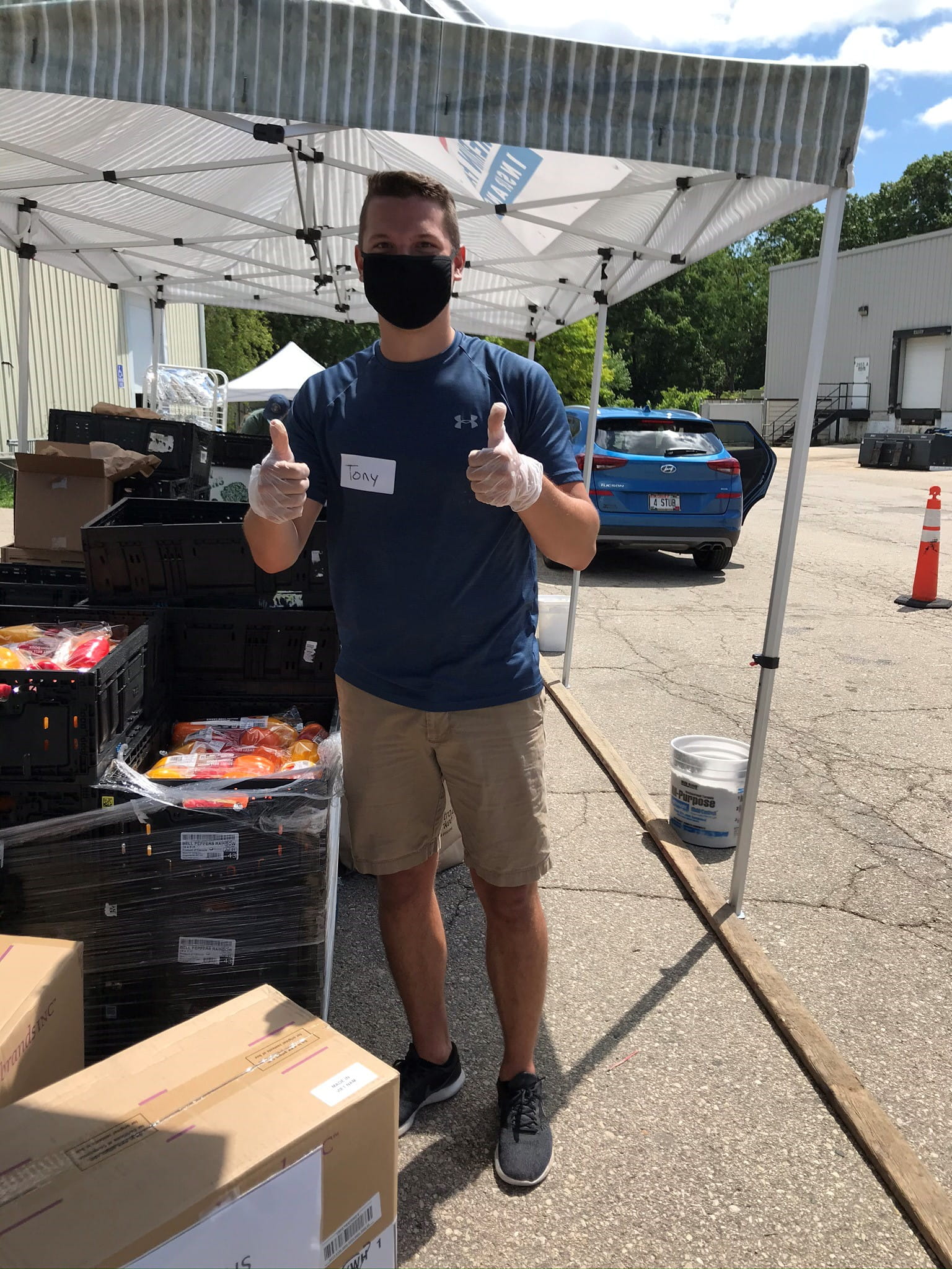 Tony Hildebrandt, Quality Assurance Intern, volunteered at The River Food Pantry in Madison and helped load cars with groceries for its curbside delivery program.
