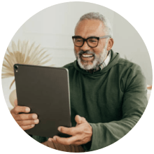 smiling man with tablet